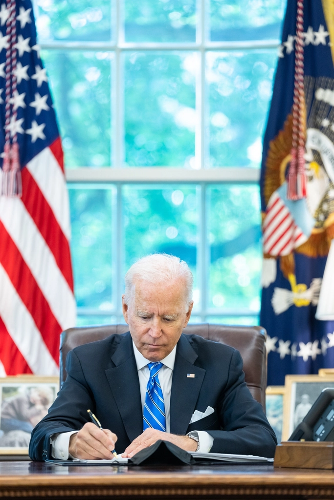 President Joe Biden works Oval