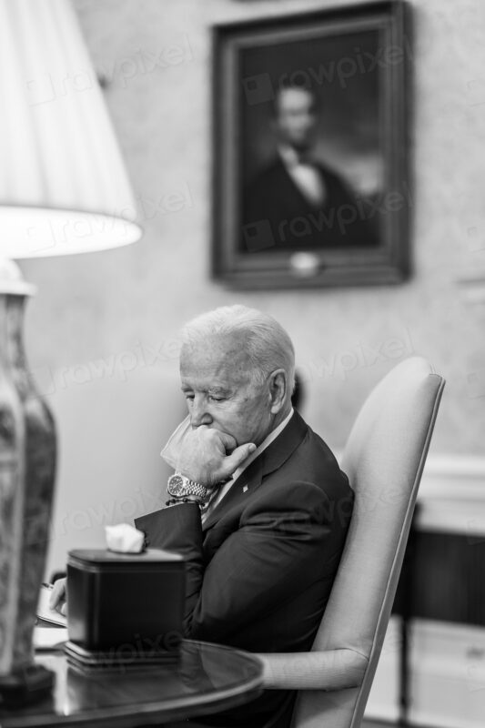 President Joe Biden listens during a weekly