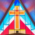 colorful geometrical stained glass window with rood