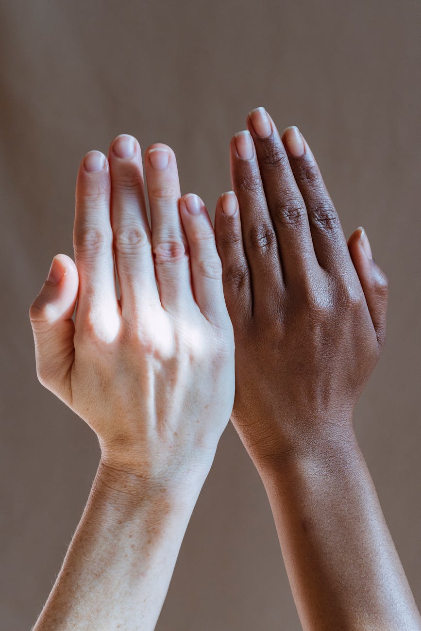 diverse women showing hands in studio